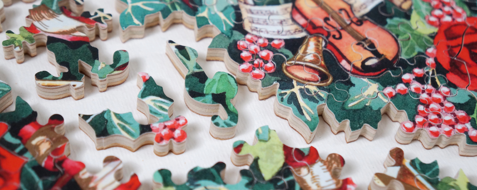 Wooden Christmas Wreaths jigsaw puzzle featuring a wreath with holly, musical notes, and instruments.